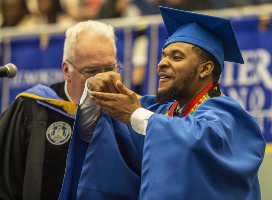 Class of 2022 Commencement Speaker Jerimiah Boyd-Johnson, a senior from Chicago, Illinois, majoring in political science, motions as to eat soup after delivering his speech Saturday afternoon in Lantz Arena. As he did after being crowned homecoming king, Boyd-Johnson did the gesture to show he got what he came for.