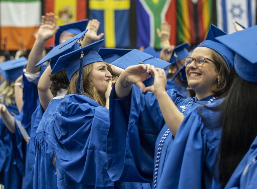 Graduates of the Eastern class of 2022 wave and acknowledge family and friends before the start of the commencement ceremony Saturday afternoon in Lantz Arena.