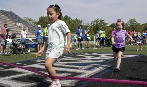 Runners participate in the Toddler Trot on the OBrien Stadium football field 50-yard line during the Sarah Bush Lincoln Health Center Races for all Paces event Saturday morning.
