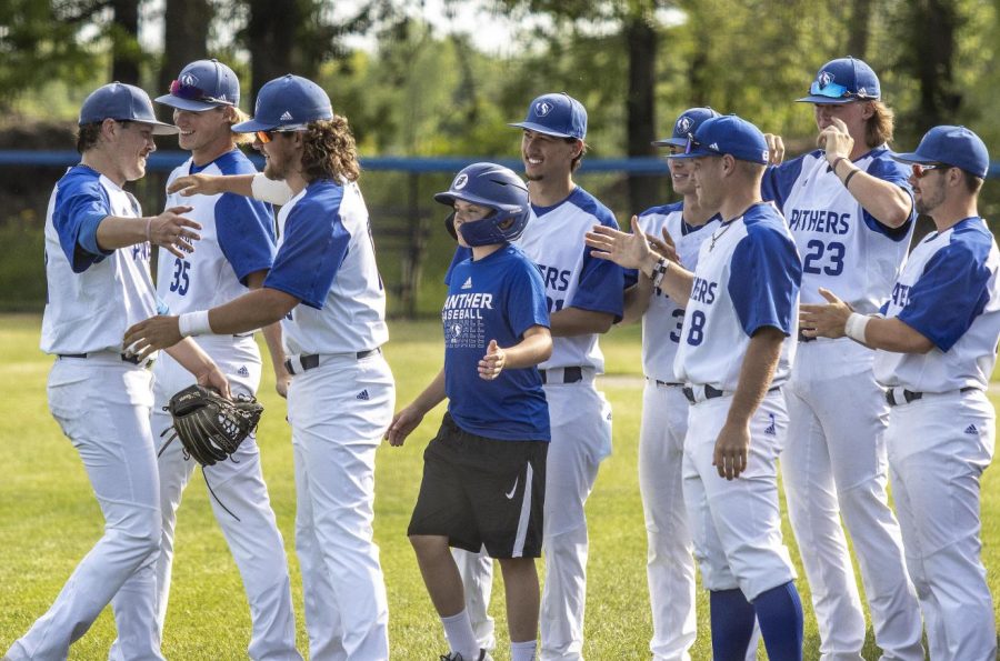 In+the+top+of+the+eighth%2C+left%2C+Jason+DeCicco%2C+a+senior+left-handed+pitcher%2C+is+relieved+after+Jackson+Nichols%2C+a+sophomore+right-handed+pitcher%2C+during+the+Panthers+Senior+Day+game+against+the+Western+Illinois+University+Leathernecks+Tuesday+afternoon.+After+stepping+off+the+mound%2C+DeCicco+embraces+most+of+the+team+exchanging+sentiments+with+them.