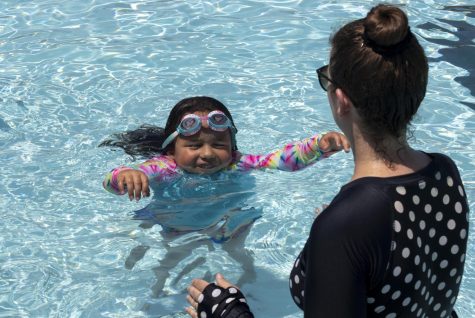 Six-year-old Dulce Stern swims towards her mom Chelsea Stern at the Rotary Community Aquatic Center pool in Charleston Ill. on Tuesday, June 14, 2022. Chelsea said the two come out here almost every day to swim and have fun, plus it helps burn off some energy. Dulce said she loves jumping off the diving board and going on the slide with her dad. 