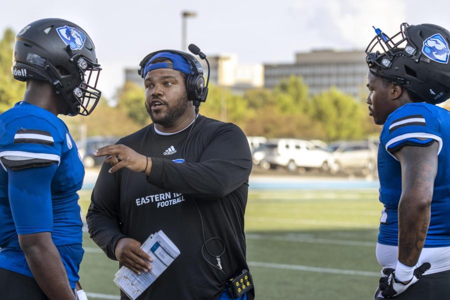Assistant Defensive Line Coach, Adam Morris talks to players after a practice drill during football practice Tuesday afternoon at OBrien Field. Morris was hired in February 2021 and will start his second season this year in 2022. 