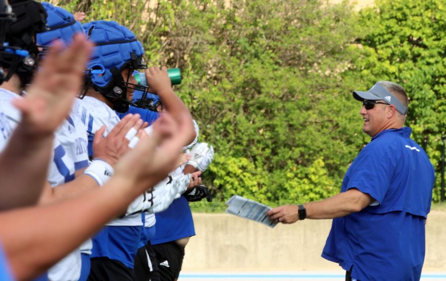 Eastern Football Head Coach Chris Wilkerson tells his players to give themselves three claps during practice Monday afternoon at OBrien Field.