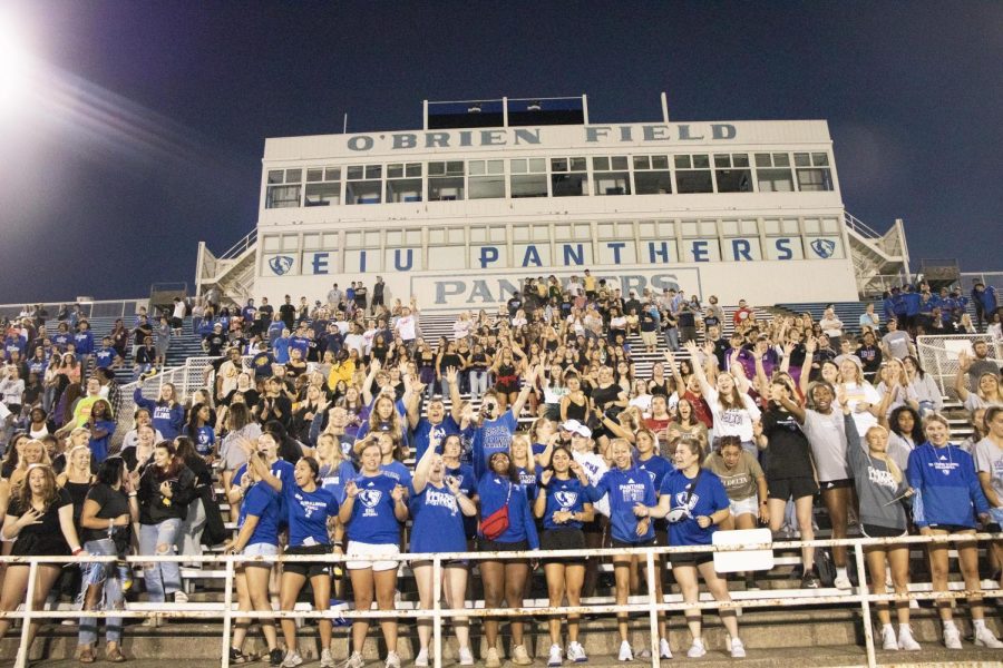 Students yell to try to catch t-shirts being thrown into the crowd at the First Night Spirit Rally Sunday night.