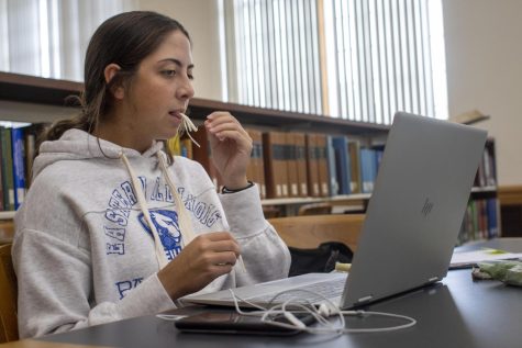 Brittany Steven, a senior exercise science, snacks on string cheese while studying in Booth Library Monday afternoon. Stevens said string cheese is her favorite healthy snack.