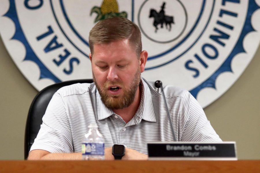 Charleston Mayor, Brandon Combs, reads out a ordinance which provides an additional amount of Tax Increment Financing funds to The Body Club at 618 Jackson Avenue at Tuesday afternoons City Council meeting at City Hall.