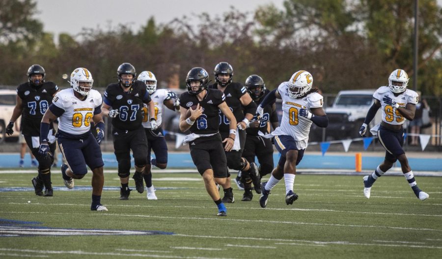 Jonah OBrien, a redshirt sophomore quarterback, runs through hole found in the University of Tennesee- Chattanooga Mocs defensive line during the Panthers first home game of the 2022 season on Saturday evening at OBrien Field. The Panthers lost 38-20 to the Mocs. OBrien completed 18-of-28 pass attempts, passing for a total of 183 yards with 2 touchdowns.