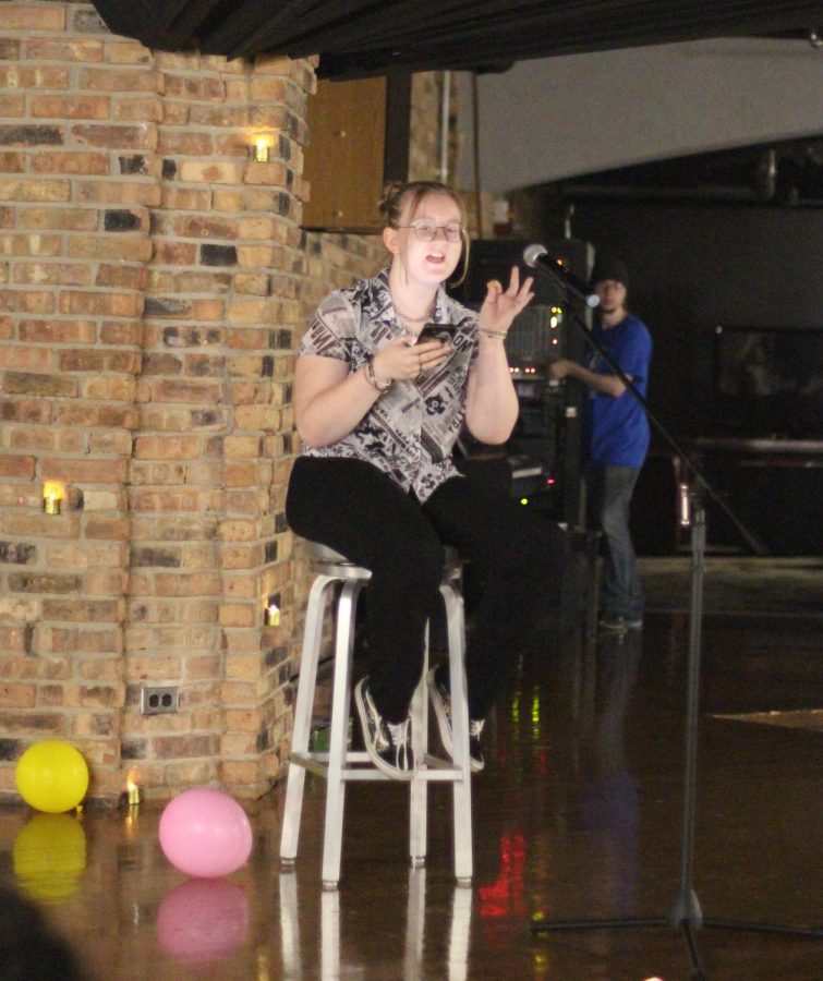 Lauren Carter, a freshman elementary education, delivers her poems during the Poetry Slam event in 7th Street Underground Thursday night.