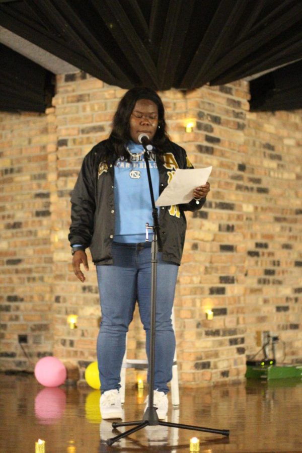 Tyeisha Mosely, a senior Spanish education major, delivers her poem called From Me to Me (De Mi a Mi) during the Poetry Slam event in 7th Street Underground Thursday night.