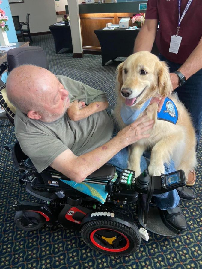 Rachel the Therapy Dog visits members of Heritage Woods, an assisted living facilty in Flora, Ill. on Thursday, April 28, 2022.