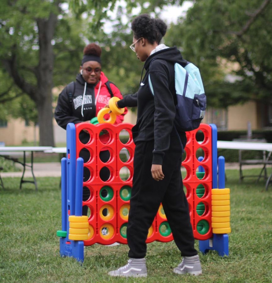 Razhane Surratt (right), a clinical lab sciences major, plays giant Connect-Four with Jamelia Holman, a freshman psychology major, at the Charleston Round Up Friday afternoon in South Quad.