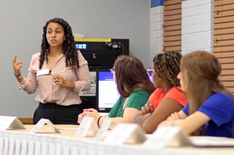 Student Senate Speaker Jasmine Yusef, a senior English major, announces the committees senators are on during the Senates first meeting on Sept. 7 in the Arcola Room at the Martin Luther King Jr. University Union on the Eastern Illinois University campus in Charleston, Ill.