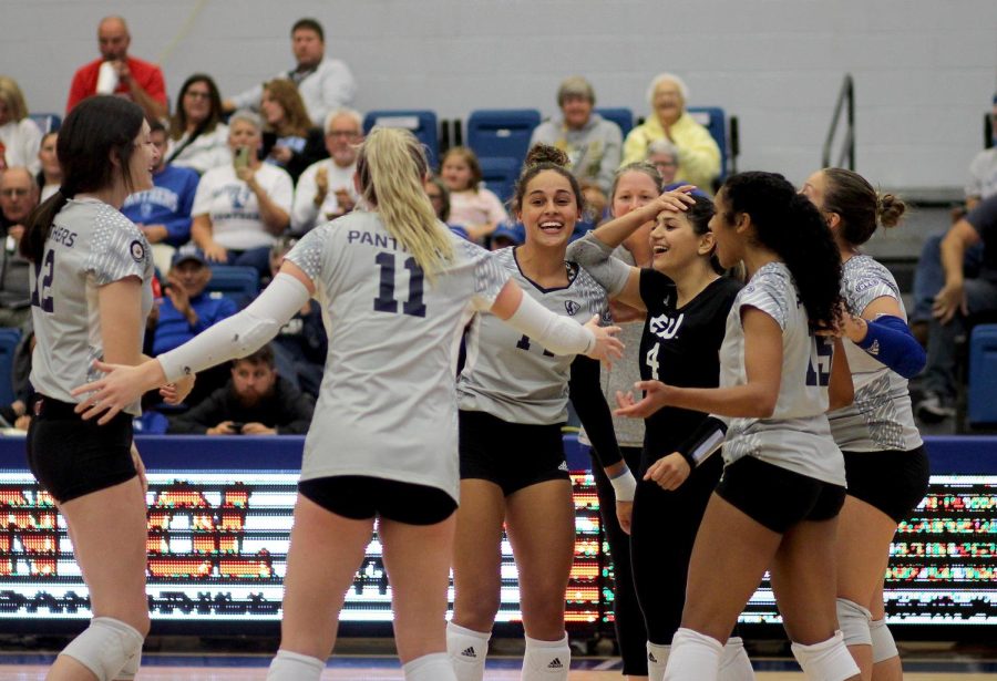 Freshman outside and opposite hitter, Lilli Amettis (left), and junior libero and defensive Specialist Christina Martinez Mundo (right) celebrate with their team after scoring a point in the third set against the Southern Illinois University Edwardsville Cougars at Lantz Arena Friday evening. The Panthers won 3-1 against the Cougars.