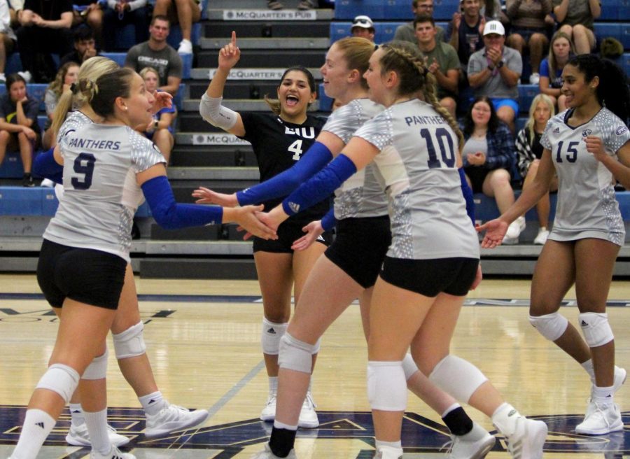 Players meet up after a successful play during the match against the Western Illinois University Leathernecks Tuesday evening at Lantz Arena. The Panthers lost 3-0 to the Leathernecks.