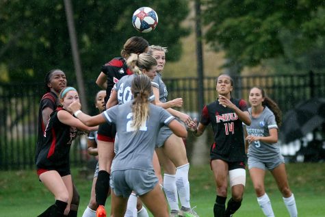 Players attempt to head a ball during the Sunday afternoon soccer game between the  Panthers and Northern Illinois University Huskies at Lakeside Field. The Panthers lost 2-1 against the Huskies.