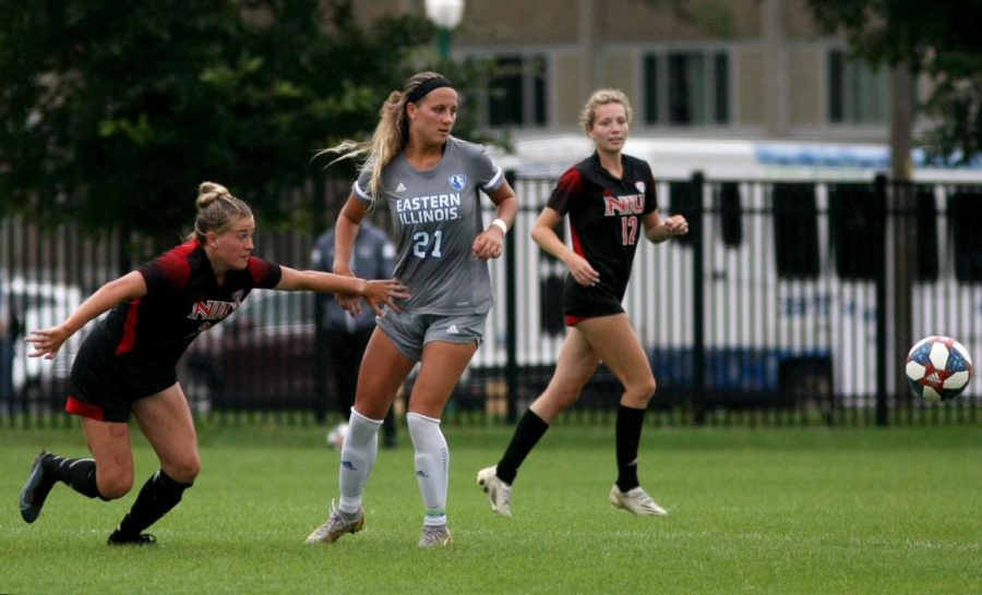 Number 21, Kenzie Balcerak, a senior midfielder, fights with Northern Illinois University players for control over the ball during the Sunday afternoon soccer game between the Eastern Panthers and NIU Huskies at Lakeside Field. The Panthers lost 2-1 against the Huskies.