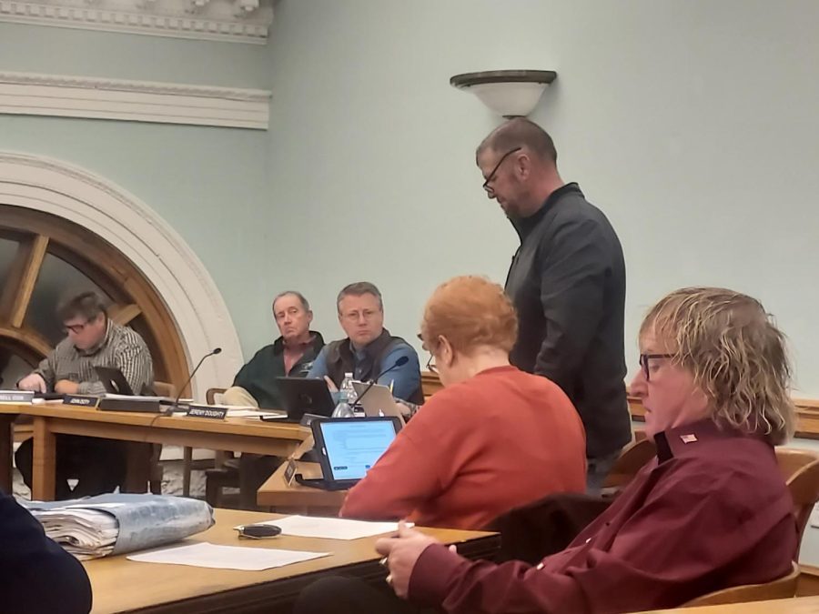 Coles County Board member Stan Metzger reads a recommendation by the States Attorney office to be added to the amended ordinance before voting at Tuesday nights meeting. The Standards for Wind Energy Conversion Systems over 500kW amended Coles County Board ordinance was approved 8-4.