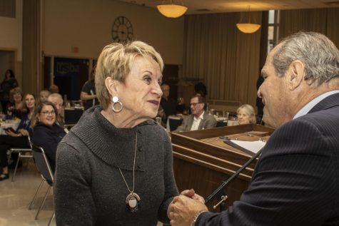 Mary Anne Hanner, president of alumni services, accepts a 50 anniversary commemorative pin from University President David Glassman during the class of 1972s 50 anniversary reunion at the Martin Luther King Jr. University Unions University Ballroom Friday afternoon.