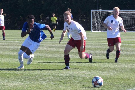 Number 17 Lesego Maloma, a junior forward, races Southern Indiana players to the ball during the home soccer game at Lakeside Field Saturday afternoon. Maloma had 3 shots on goal and played for 80 minutes. The Panthers lost 3-2 against Southern Indiana.