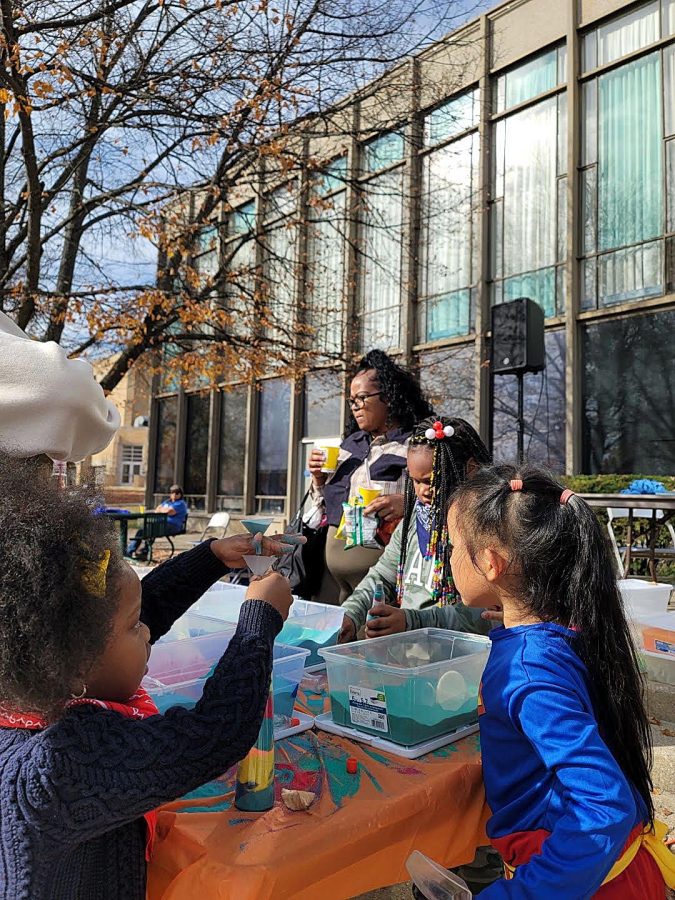 At the Family Fun Fest, families are able to do many different activities such as making sand bottles, coloring, riding the mini train, eating snow cones, and more outside in the Library Quad Saturday afternoon.