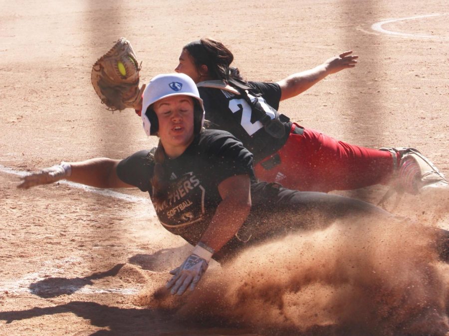 An Eastern softball member slides to home base at their game vs. the Wabash Valley College team at Williams Field. The Panthers won against Wabash Valley College.