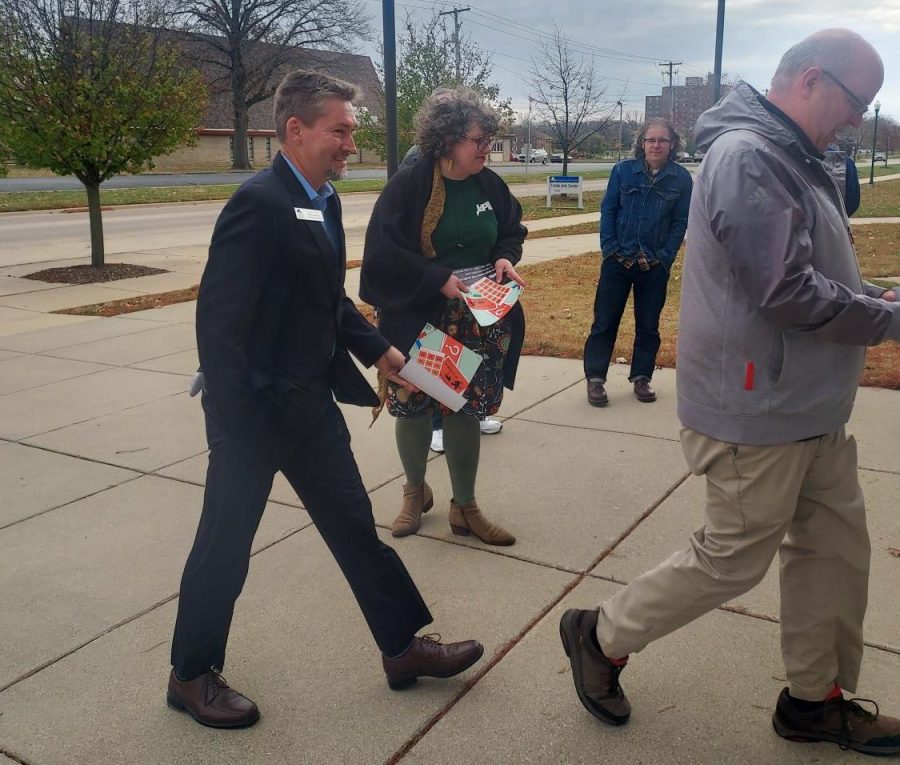 Easterns chapter of University Professionals of Illinois, EIU-UPI, handed flyers to trustees, administration and attendees about the ongoing contract negotiations outside of Tarble before the Board of Trustees meeting on Friday.