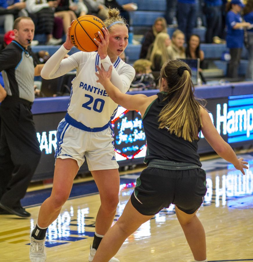 Julia Bengtson (20), a sophomore guard, looks for someone to pass to while being defended during the womens basketball game against the Rowdy Raiders at Lantz Arena Monday afternoon. Bengtson had four rebounds, two assists and scored nine points. The Panthers won 96-67 against the Rowdy Raiders. The Panthers have won seven games in row.
