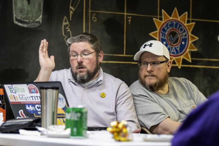 Democratic Candidate Matt Titus throws his hand up in the air after looking at the incomplete election results where he had a projected loss at the Coles County Democrats Headquarters Tuesday night.