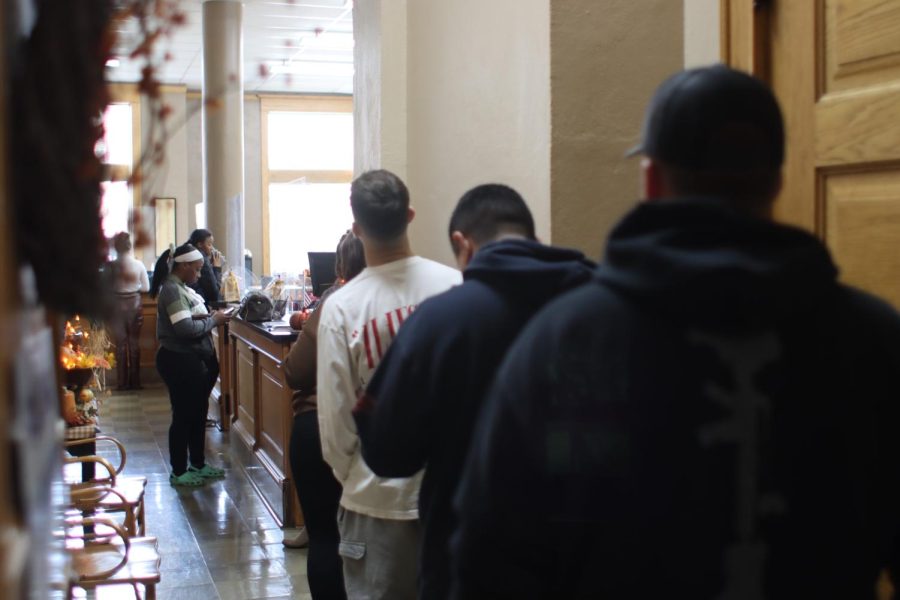 Charleston residents wait in line to vote at the Coles County Courthouse. 