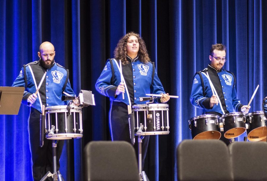 From left, David Oliveira Martins, a graduate student studying music, Garrison Reed, a junior music education major, and Matthew Riley, a senior organizational development major, perform as  the Panther Marching Band Drum Line during the PMB Concert in the Dvorak Concert Hall Sunday afternoon.