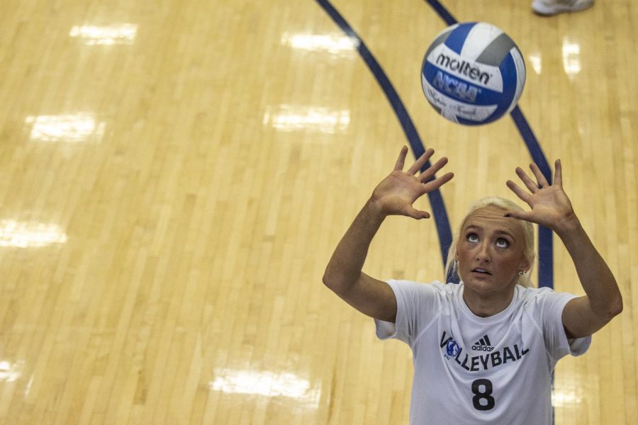 Summerlyn Smith (8), a senior setter, puts up the ball during volleyball practice in Lantz Arena Thursday afternoon. 