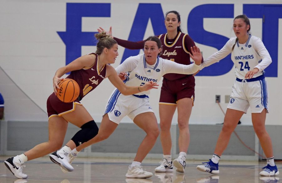 Maya Chandler (10), a junior guard, is defended by Miah Monohan (3), a sophomore guard as she approaches the Panthers hoop during the womens basketball game against the Loyola University Chicago Ramblers in Lantz Arena Sunday afternoon. Monahan scored five points with six assists and four rebounds. The Panthers won 83-73 against the Ramblers.