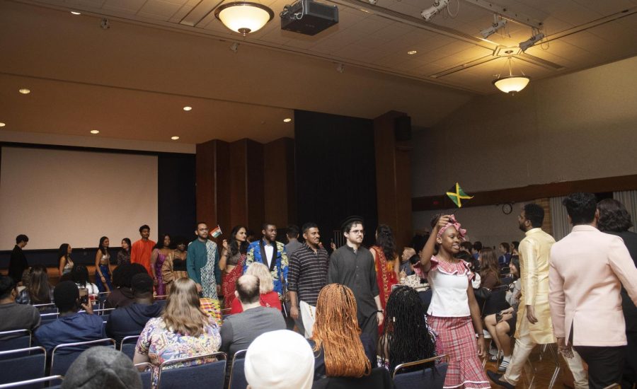 For the end performance of Global Culture Night, many students show off their countrys traditonal attire in a fashion show by walking by themselves then all together in the Grand Ballroom of Martin Luther King Jr. University Union.