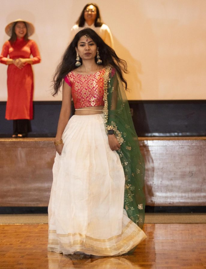 Sajani Reddy Singapuram, a computer technology graduate student, walks down the runway to be apart of the fashion show at the Global Culture Night event in the Grand Ballroom of Martin Luther King Jr. University Union.