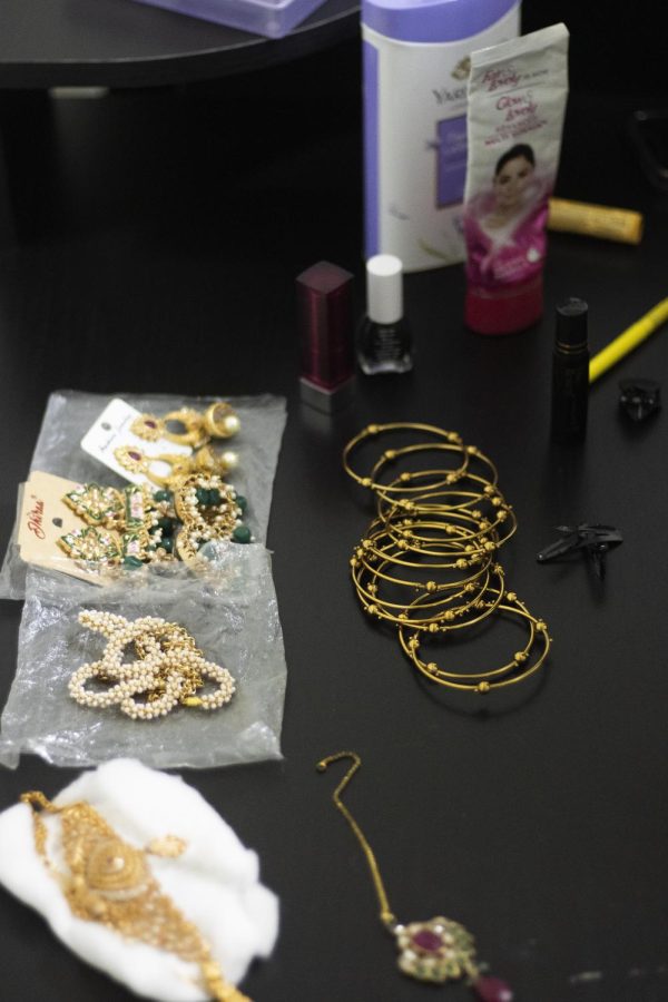 Sajani Reddy Singapuram, a computer technology graduate student, lays out her jewelry to choose which one she wants to wear for her performance at the Global Culture Night.