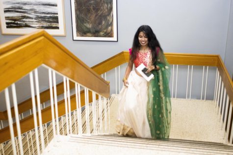 Sajani Reddy Singapuram, a computer technology graduate student, dressed in her saree, along with other traditional Indian attire and jewelry, walks up the stairs and into the Grand Ballroom of Martin Luther King Jr. University Union for her singing performance at the Global Culture Night 
