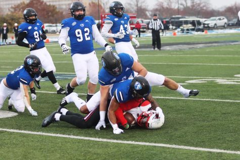 Linebacker Colin Bohanek (45), and defensive back Mark Aitken (2), tackles a Southeast Missouri player during their game Saturday afternoon. The Panthers lost to the Redhawks 31-7 on the OBrien Field.
