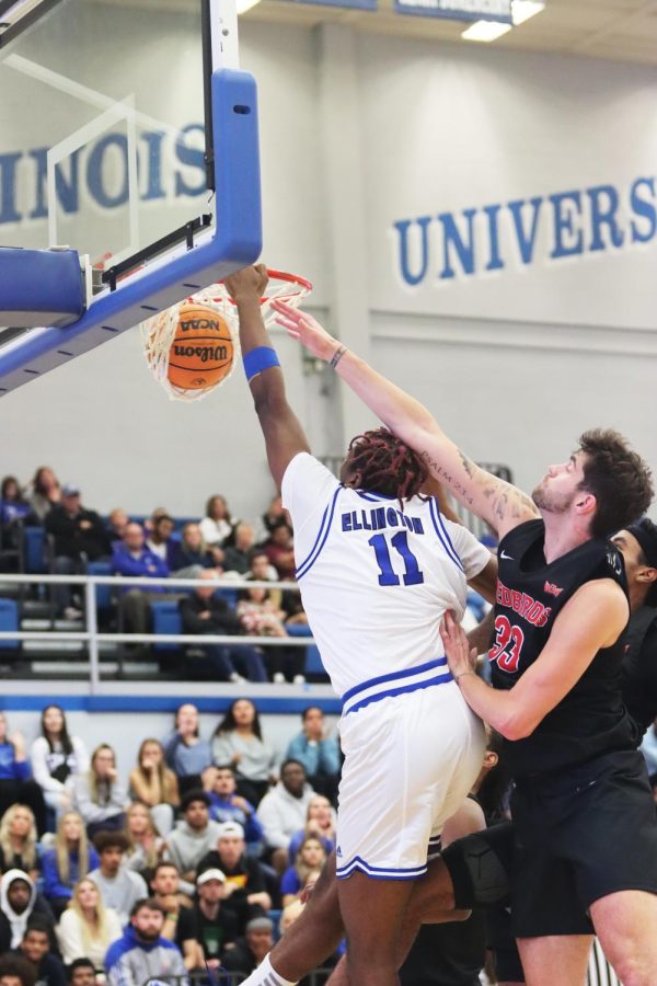 Center Nick Ellington (11), dunks the ball for the second time of the night and earns 8 points at their game against Illinois State University. The Panthers lost to the Redbirds 54-49 in Lantz Arena.