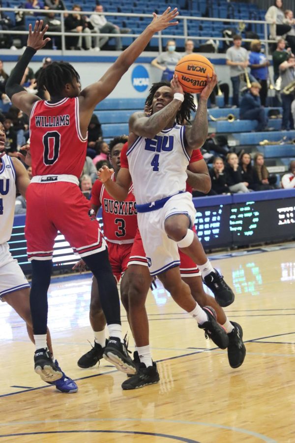 Guard Yaakema Rose Jr. (4), attempts to shoot the ball into the basket during the game against Northern Illinois University. The Panthers lost to the Huskies 90-70 on Wednesday night in Lantz Arena.