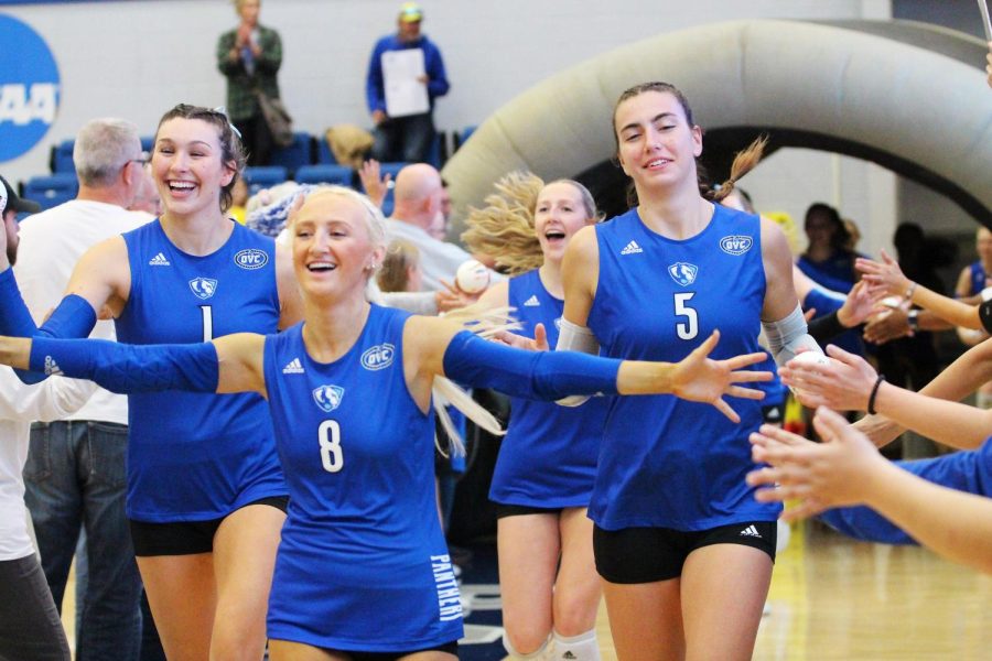 Seniors Ireland Heib (left), Summerlynn Smith (middle), and Annika Black (right), run out of the fan tunnel before their match against Tennessee Tech at Lantz Arena. The Panthers lost 3-2 against the Golden Eagles.