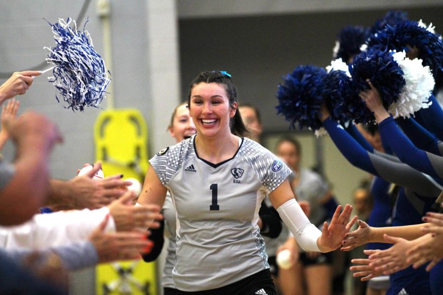 Middle blocker, Ireland Heib (1), runs out of the fan tunnel and high-fives fans before their last home match against University of Southern Indiana at Lantz Arena. The Panthers won 3-0.