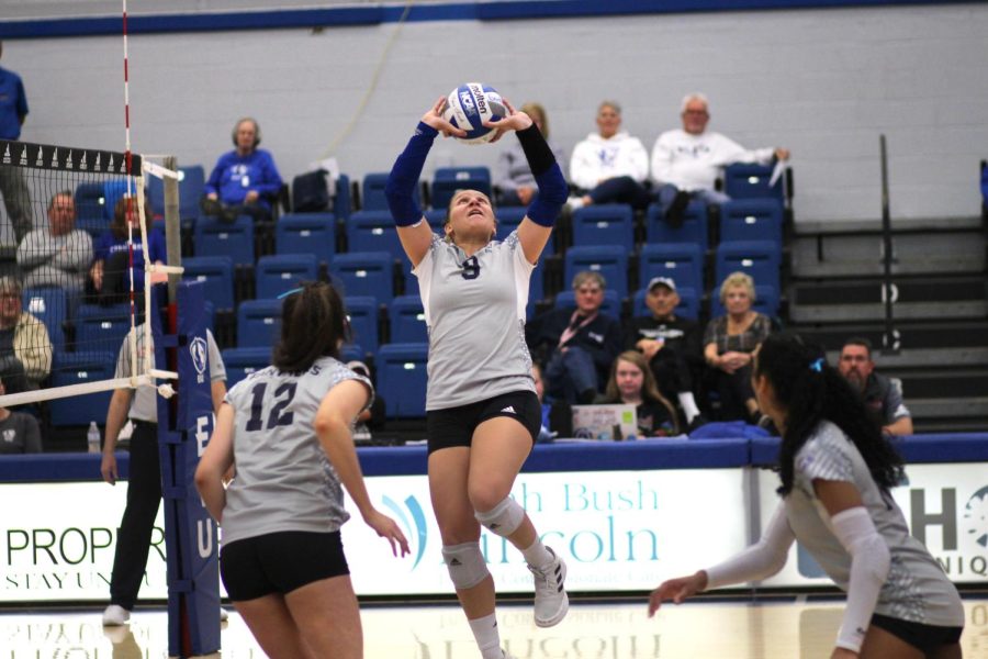 Setter, Catalina Rochaix (9), sets the ball to set up a spike for outside hitter Giovana Larregui Lopez (15) against University of Southern Indiana at Lantz Arena. The Panthers won 3-0.