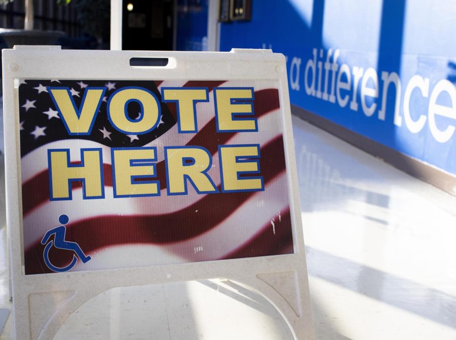 Signs are displayed in the Bridge Lounge of Martin Luther King Jr. University Union where people can vote in the upcoming elections on Wednesday afternoon.