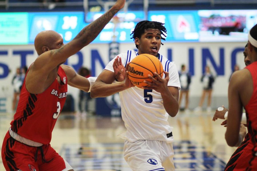 Eastern forward, Sincere Malone (5), takes the ball up the middle of the court, going through Ball State forward Mikey Pearson Jr. (3) to attempt a shot in Lantz Arena on Wednesday night. The Panthers lost to the Cardinals 76-59.