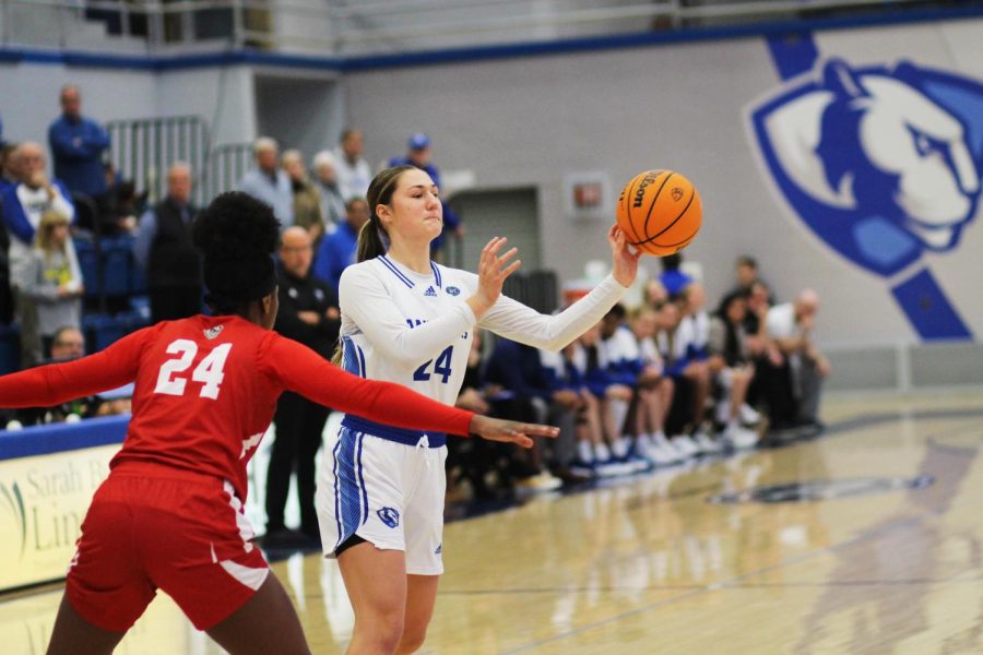 Senior forward Morgan Litwiller (24), one-hand passes the ball to a teammate during an offensive posession during the womens basketball game in Lantz Arena Tuesday evening. Litwiller was third on the team with 11 points and led with six rebounds. The Panthers lost 72-61 to the Bradley Braves.