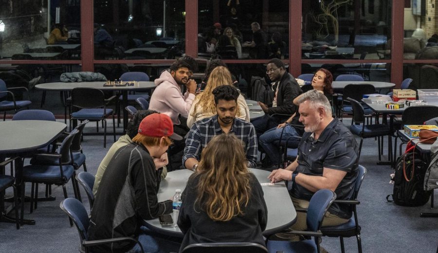 Students and faculty play board games at a game night in the Martin Luther King Jr. University Union Bridge Lounge Thursday night.