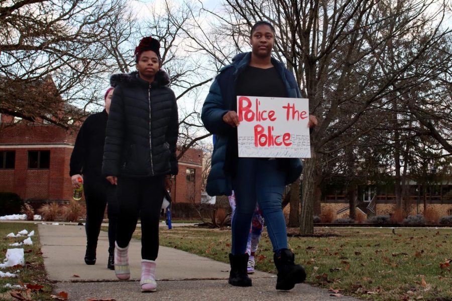 Daisha Mitchell (right), a junior health sciences major, walks with fellow students in protest of recent police brutality in Memphis, Tenn., which killed Tyre Nichols, a 29-year-old Black man, according to CNN. The group walked around 20 minutes from Andrews Hall to the front of Old Main Saturday afternoon.