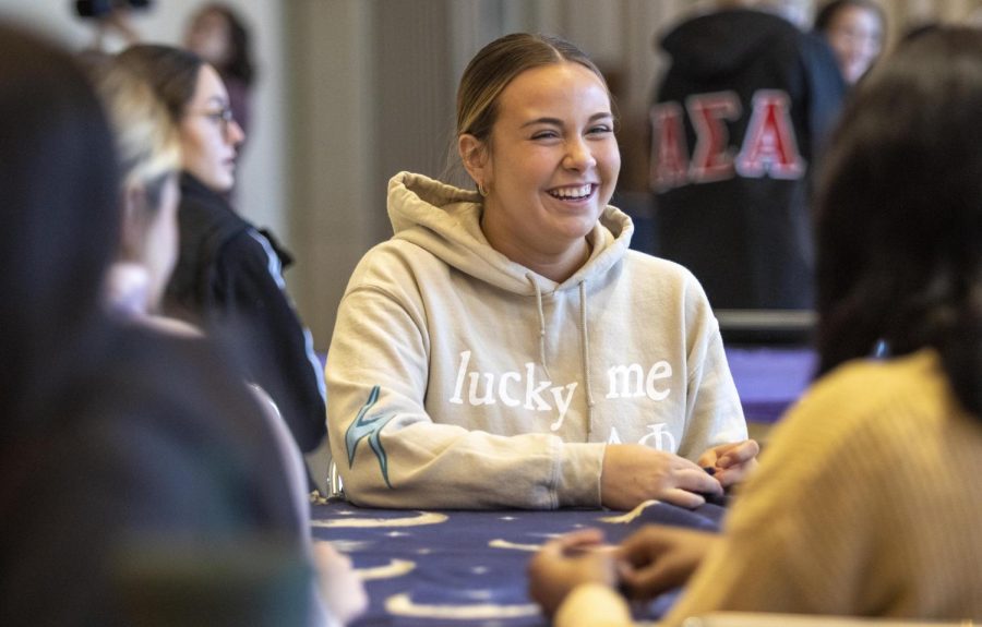 Cameron Brown, a junior physical science major, ties blankets with fellow members of Alpha Phi Sorority during the Martin Luther King Jr. Day of Service on Monday afternoon in the University Ballroom. Brown said she thinks it is important to give back to the community.