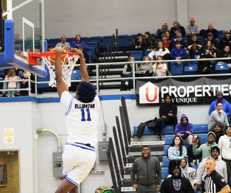Eastern center, Nick Ellington (11) dunks the ball on a breakaway during their game against Little Rock in Lantz Arena. The Panthers won 70-63 against the Trojans Saturday evening.