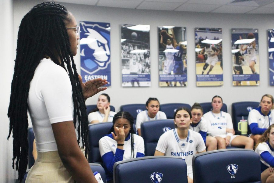 The womens basketball assistant coach, Mariah King, instructs the team in the locker room at halftime during their game against Little Rock on Saturday.